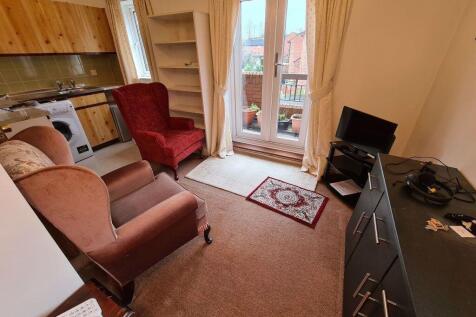 A cozy living room with comfortable armchairs a...
