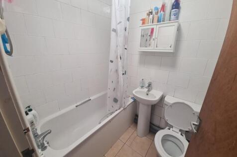 Bright and clean bathroom featuring a full-size...