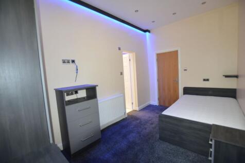 A modern bedroom featuring a double bed, sleek ...