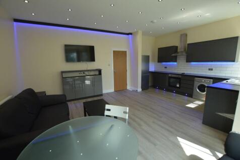 Modern and spacious living room featuring a lar...