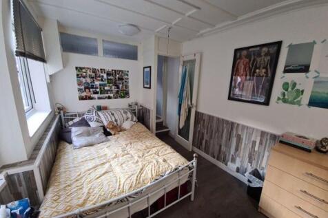 Bright and cozy double bedroom featuring a comf...