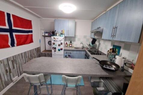 A well-organized kitchen featuring modern appli...