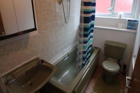 A clean and well-maintained bathroom featuring ...