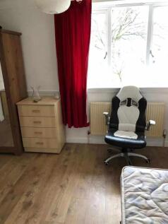 A neat single bedroom with natural light coming...