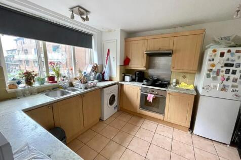 Bright kitchen with ample counter space, large ...