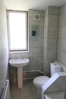Bright and tidy bathroom featuring a large fros...