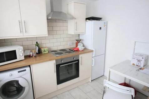 Bright and clean kitchen featuring modern appli...
