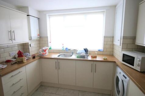 Bright kitchen featuring ample natural light fr...
