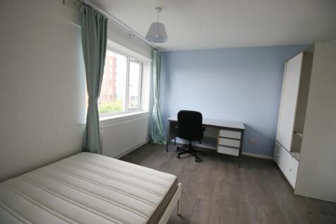 A bright and tidy single bedroom featuring a la...