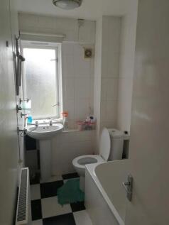 Bright and neat bathroom suite with a classic b...