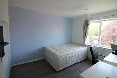 Bright and tidy double bedroom featuring a comf...