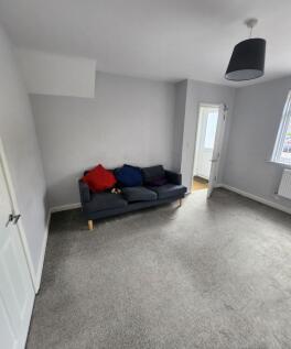 Bright and welcoming living room featuring a co...