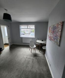 Bright and welcoming living room with large win...