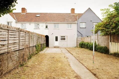 Well-maintained rear garden with a straight pav...