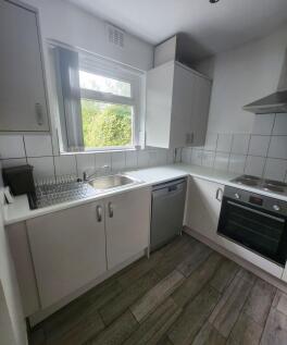 Bright and clean kitchen with ample natural lig...
