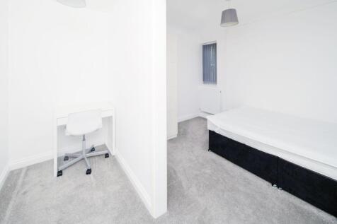 Bright, freshly redecorated bedroom with neutra...