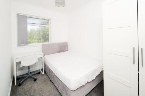 Bright, freshly decorated bedroom with a comfor...