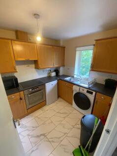 Bright and functional kitchen with ample cabine...