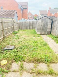 Private rear garden with lawn area, paved path ...