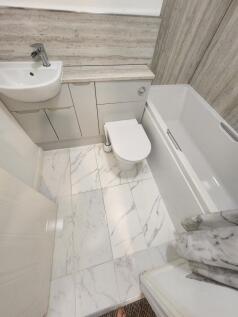 A modern, well-maintained bathroom featuring a ...