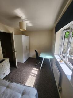 Bright and inviting living room featuring a lar...