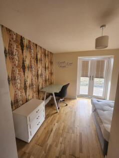 Bright and welcoming living area featuring a st...