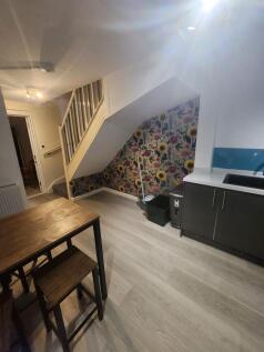 Bright and inviting living space featuring a de...