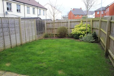 A well-maintained private garden with lush gree...