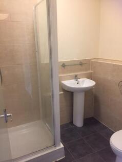 A clean and well-maintained bathroom featuring ...