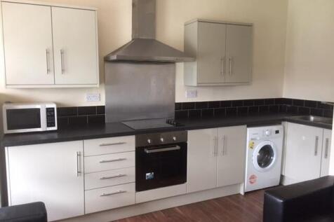 A well-maintained modern kitchen featuring whit...