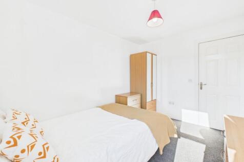 Bright and inviting double bedroom with natural...