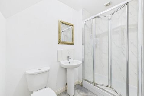 A bright and clean bathroom featuring a WC, a s...