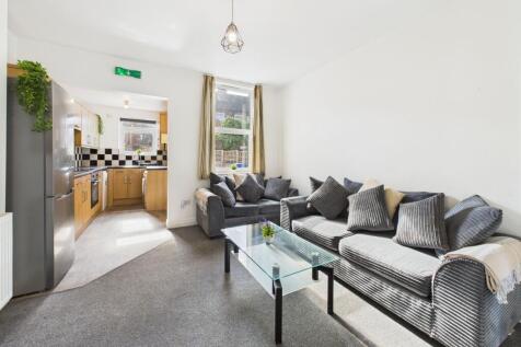 Bright and welcoming living room with large win...