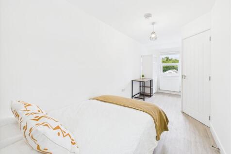 Bright and clean bedroom with a comfortable bed...