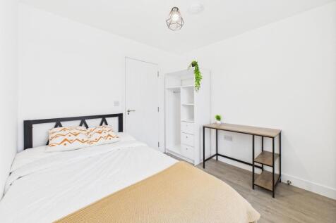 Bright and inviting double bedroom featuring a ...