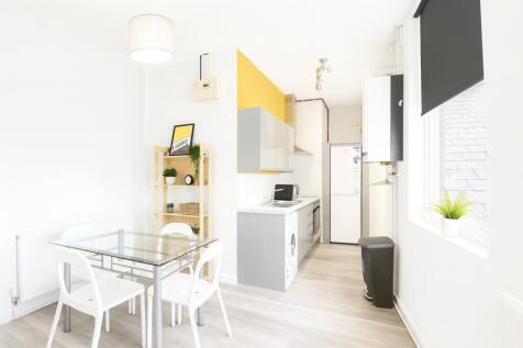 Bright and modern kitchen with ample natural li...