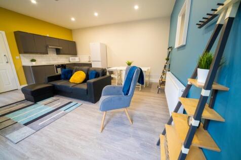 Bright and stylish living room featuring modern...