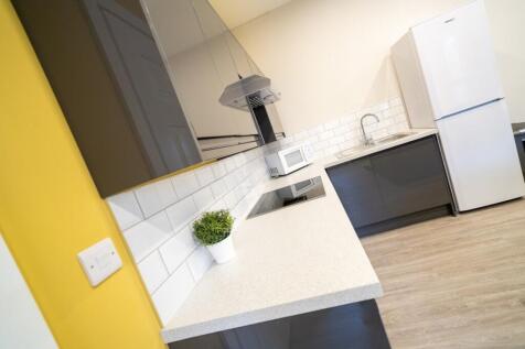 Modern kitchen with ample workspace, sleek cabi...