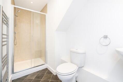 Clean and modern bathroom featuring a spacious ...