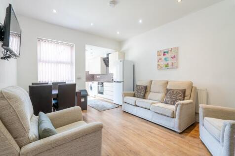 Bright and welcoming living room with comfortab...