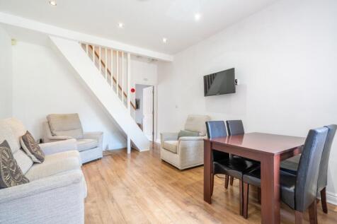 Bright and welcoming living room featuring comf...