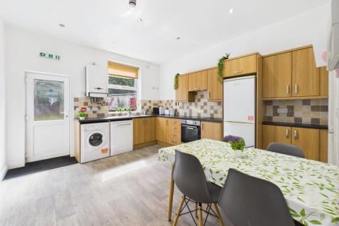 Bright and modern kitchen with ample natural li...