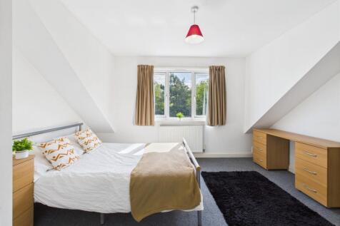 Bright and inviting double bedroom featuring a ...