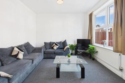 Bright and welcoming living room featuring a la...