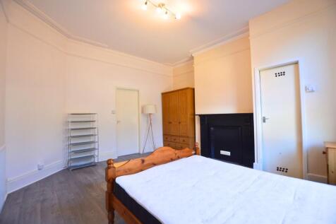 Bright and spacious master bedroom featuring a ...