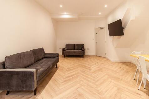 Bright and spacious living room featuring moder...