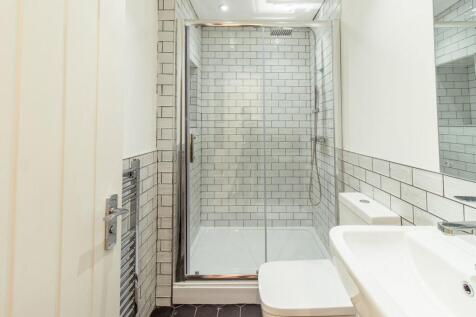 Modern bathroom with a spacious shower enclosur...