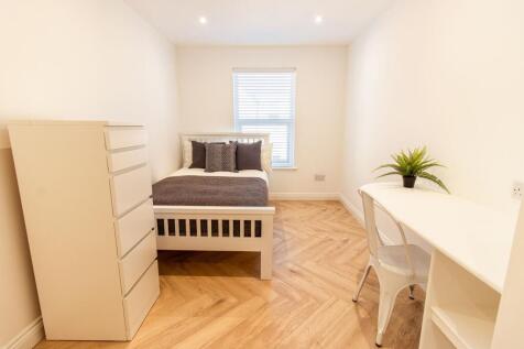 Bright and modern bedroom with a comfortable do...