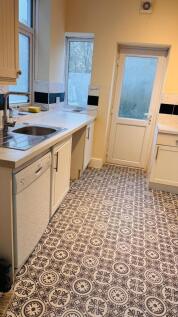 Bright and well-maintained bathroom featuring a...