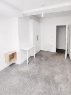 Bright, freshly redecorated bedroom with neutra...